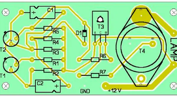Schemat elektroniczny z elementami: T1, T2, T3, T4, R1-R7, C1, C2, D1, LAMP. Widoczne oznaczenia GND i +12 V.